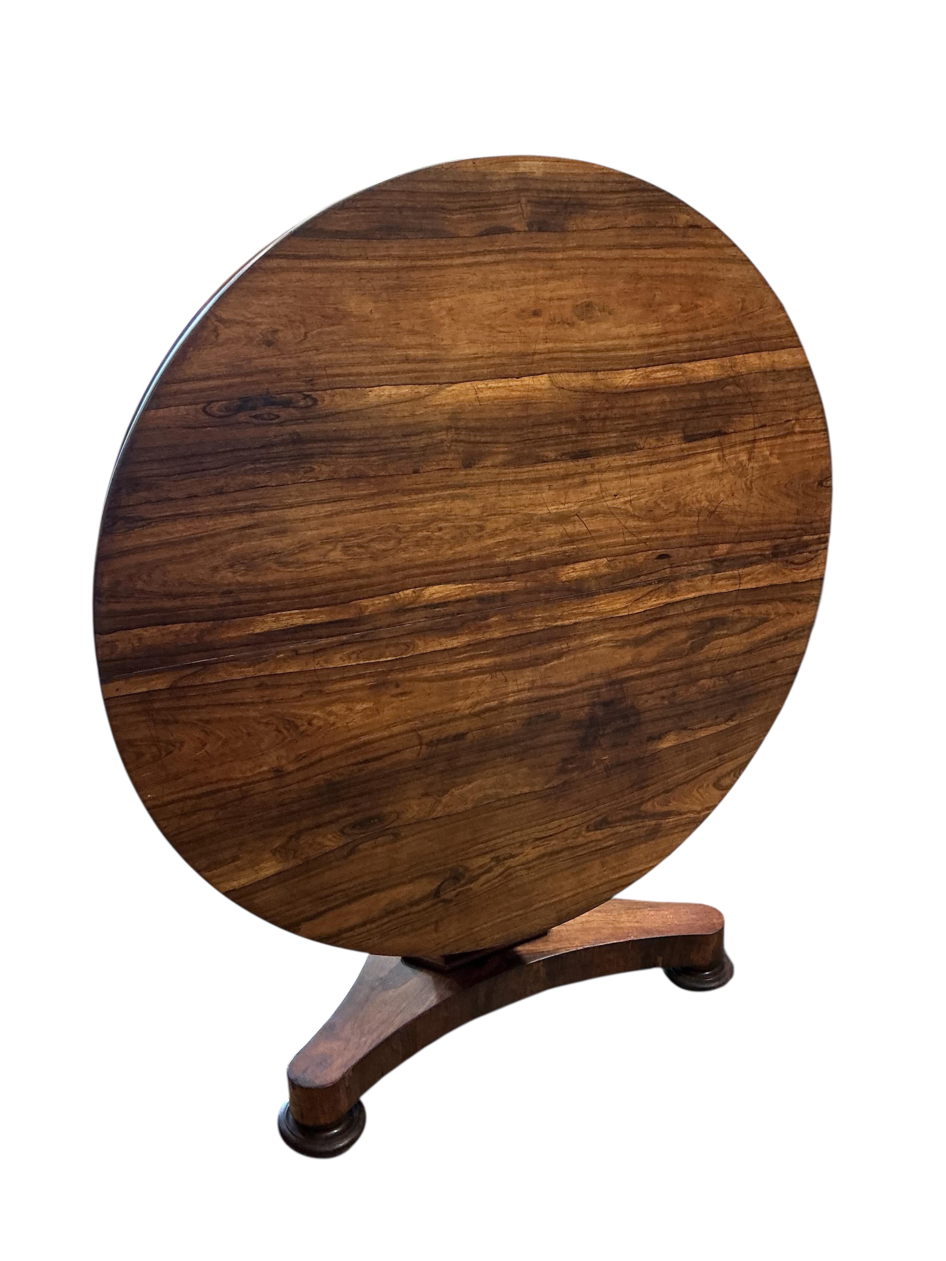 An early Victorian circular rosewood tilt top breakfast table, diameter 130cm, height 74cm